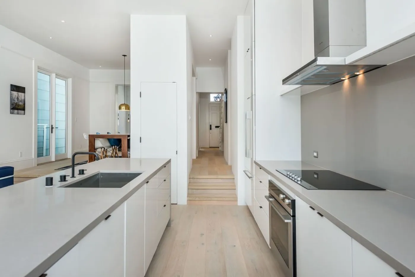 Hand-painted in-frame kitchen with range cooker, bespoke canopy and quartz splashback by McGibbon Construction, Belfast